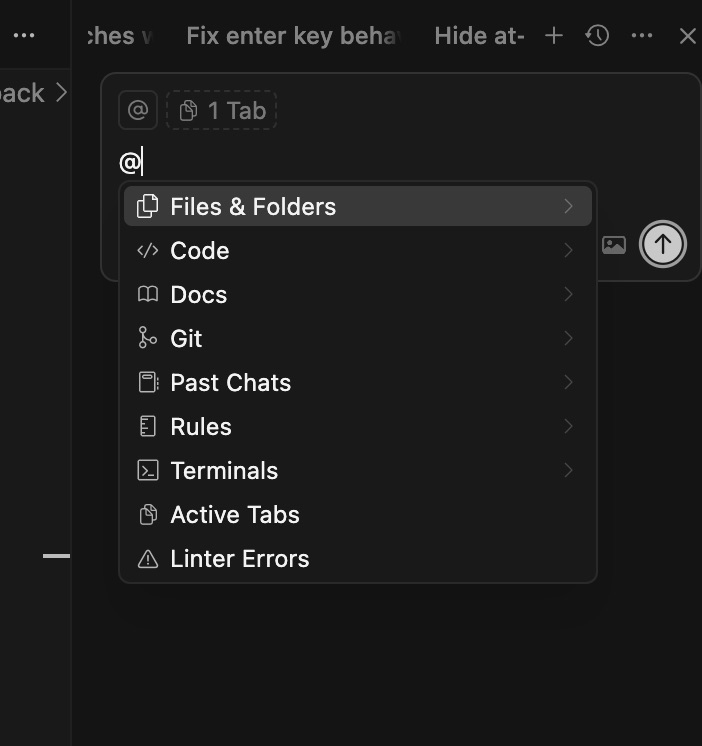 Cursor @-mention context menu showing file and code suggestions